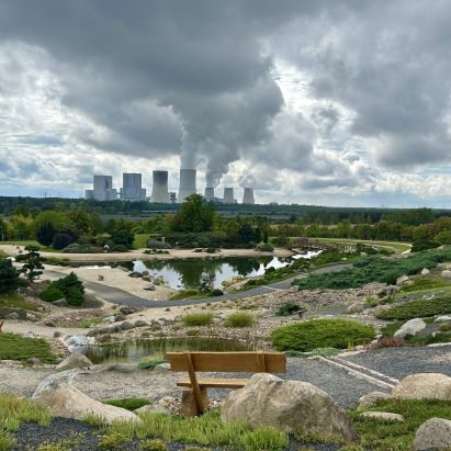 Nature picture of the boulder park in Nochten with a view of the power plant in Boxberg